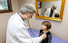 Dr. Mark Nolting with Pediatric Patient